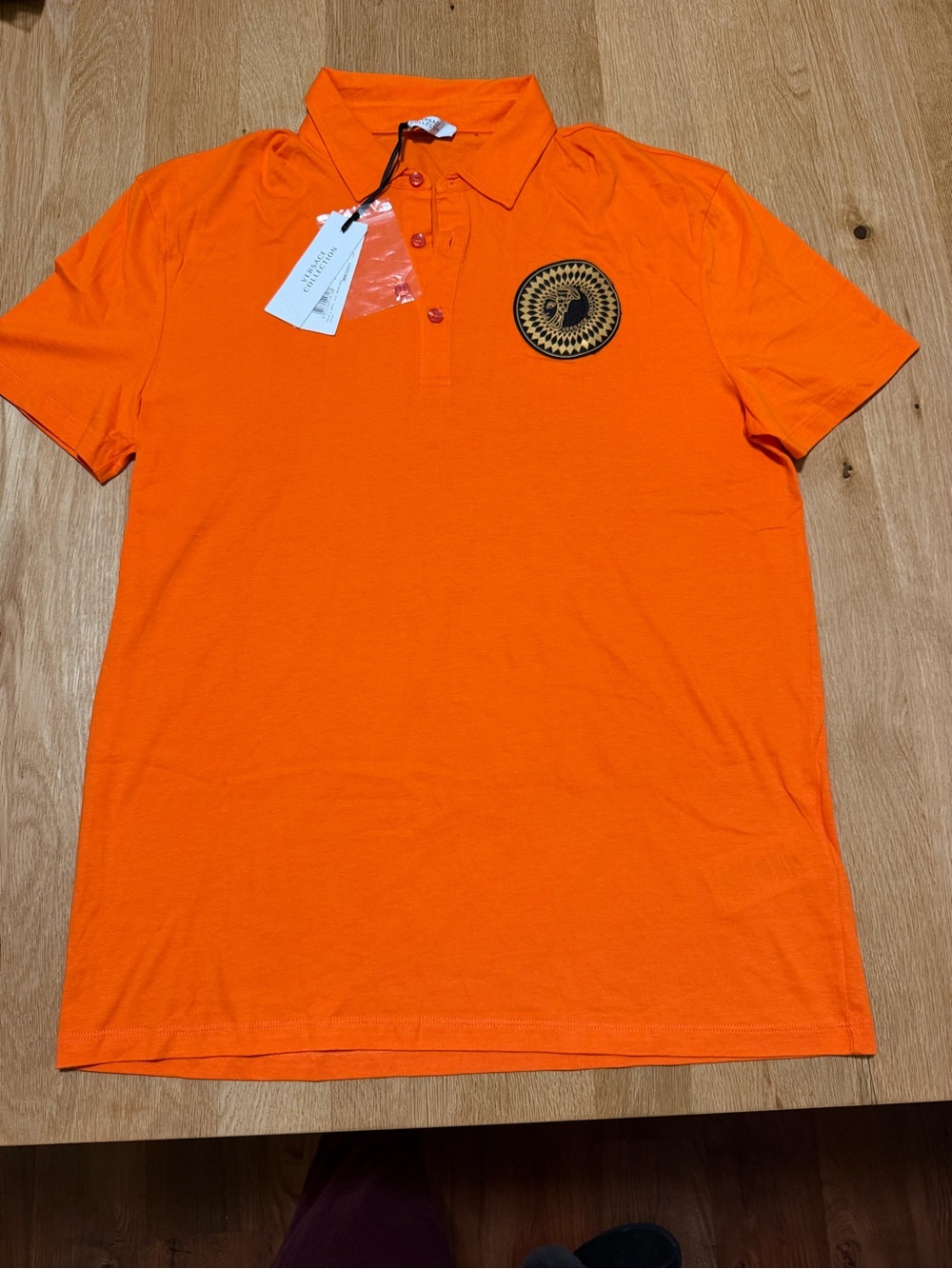 Versace Collection Bright Orange Polo with Black & Gold Medallion Patch